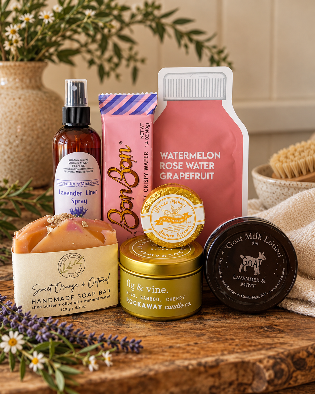 Little Luxuries self-care gift bundle with Rockaway fig and vine candle, lavender linen spray, handmade sweet orange oatmeal soap, goat milk lotion, lemon verbena shower steamer, watermelon rose water grapefruit face mask and BonBon crispy wafer from CLUTCH Market Greenwich NY