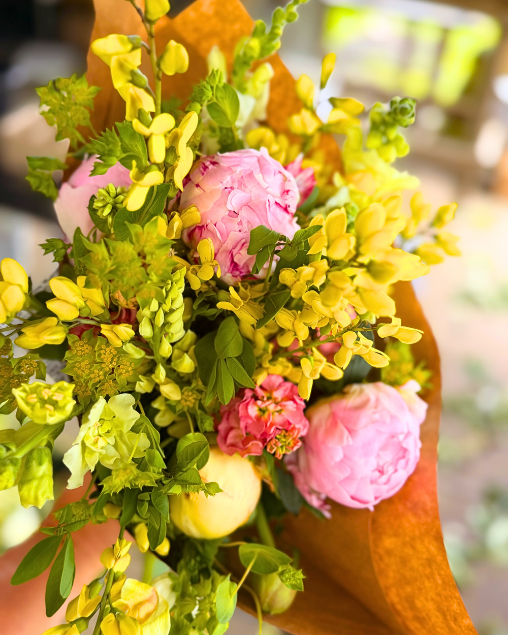 Local flower bouquet and cookie for graduation celebration