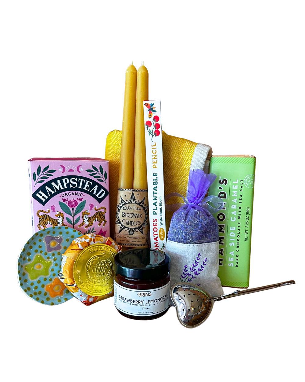 Happy Home gift bundle with beeswax candles, organic tea, lavender sachet, strawberry lemongrass spread, goat milk soap, sea caramel chocolate, plantable pencil and tea strainer from CLUTCH Market Greenwich NY