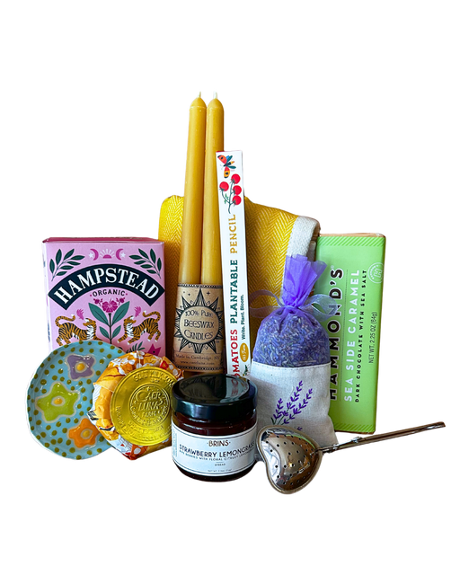 Happy Home gift bundle with beeswax candles, organic tea, lavender sachet, strawberry lemongrass spread, goat milk soap, sea caramel chocolate, plantable pencil and tea strainer from CLUTCH Market Greenwich NY