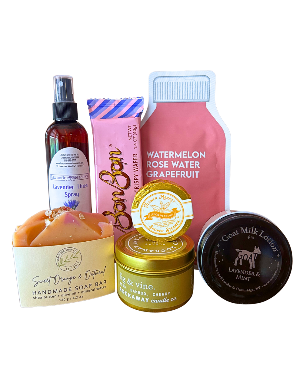 Little Luxuries self-care gift bundle with Rockaway fig and vine candle, lavender linen spray, handmade sweet orange oatmeal soap, goat milk lotion, lemon verbena shower steamer, watermelon rose water grapefruit face mask and BonBon crispy wafer from CLUTCH Market Greenwich NY