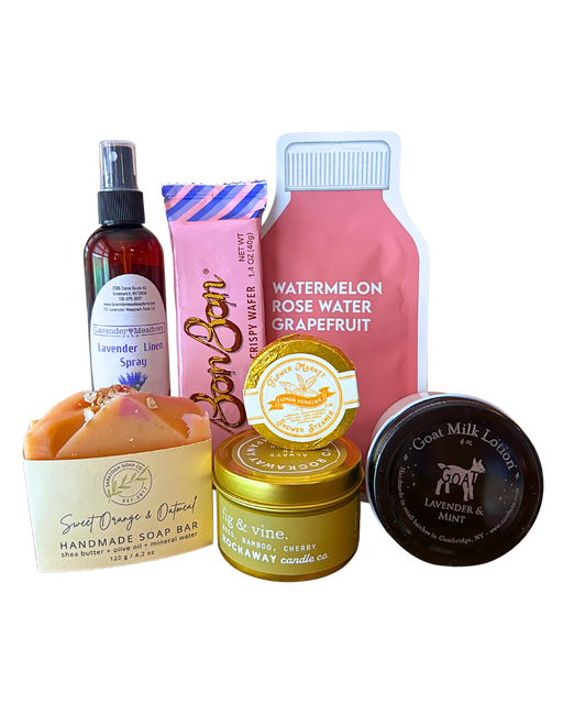 Little Luxuries self-care gift bundle with Rockaway fig and vine candle, lavender linen spray, handmade sweet orange oatmeal soap, goat milk lotion, lemon verbena shower steamer, watermelon rose water grapefruit face mask and BonBon crispy wafer from CLUTCH Market Greenwich NY
