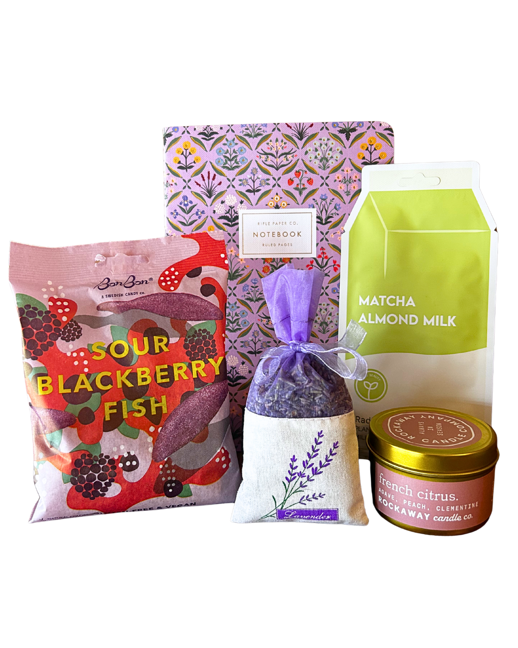 Long Distance Bestie care package gift bundle with Rockaway french citrus candle, lavender sachet, Rifle Paper Co notebook, matcha almond milk and BonBon sour blackberry fish Swedish candy from CLUTCH Market Greenwich NY