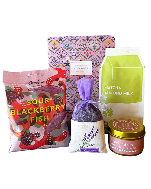 Long Distance Bestie care package gift bundle with Rockaway french citrus candle, lavender sachet, Rifle Paper Co notebook, matcha almond milk and BonBon sour blackberry fish Swedish candy from CLUTCH Market Greenwich NY