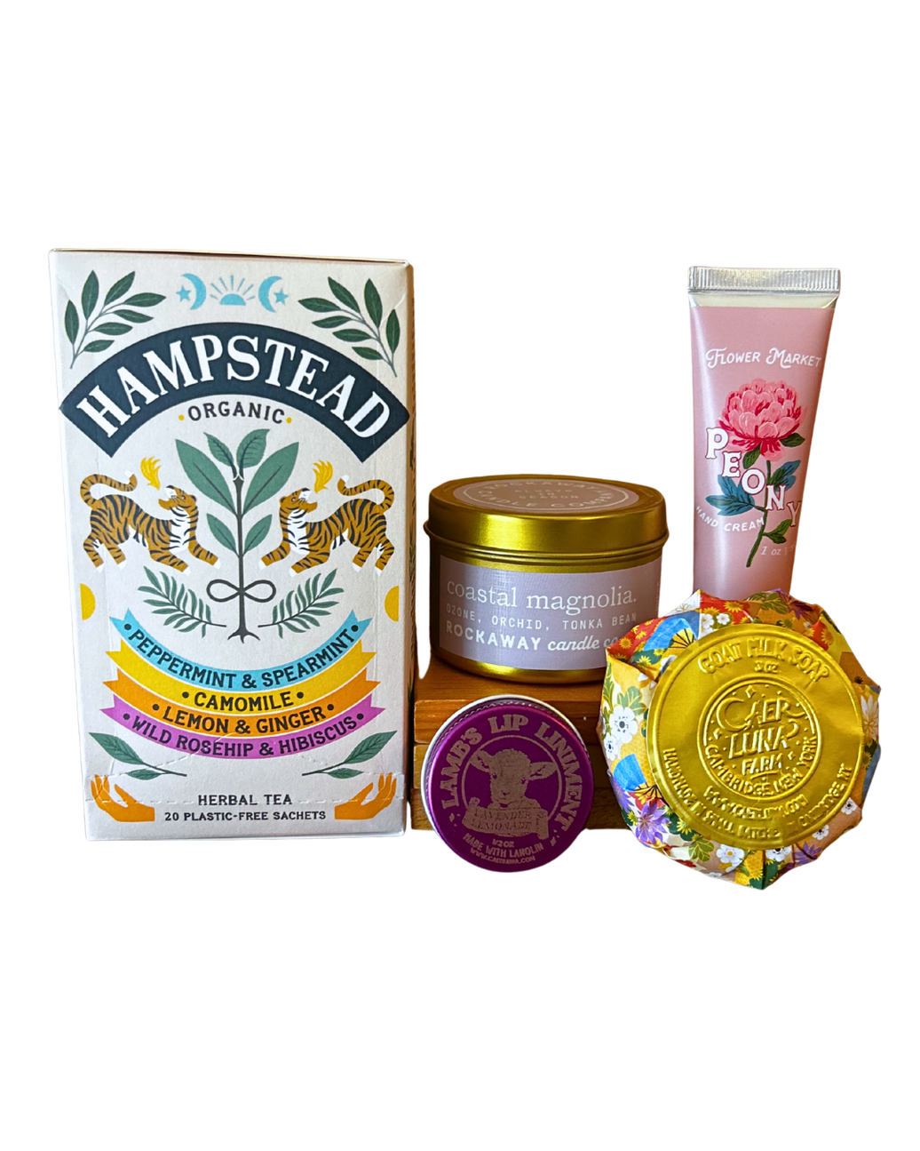 Self Care Essentials gift bundle with Hampstead organic herbal tea, Rockaway coastal magnolia candle, Flower Market peony hand cream, Lamb's lip balm and Caer Luna goat milk soap from CLUTCH Market Greenwich NY