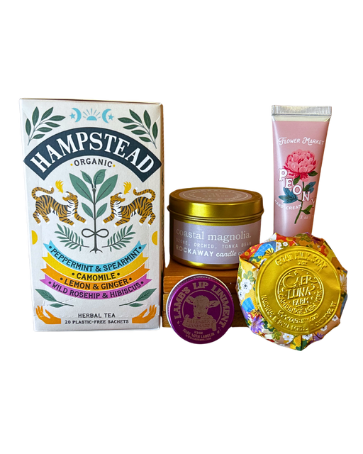 Self Care Essentials gift bundle with Hampstead organic herbal tea, Rockaway coastal magnolia candle, Flower Market peony hand cream, Lamb's lip balm and Caer Luna goat milk soap from CLUTCH Market Greenwich NY